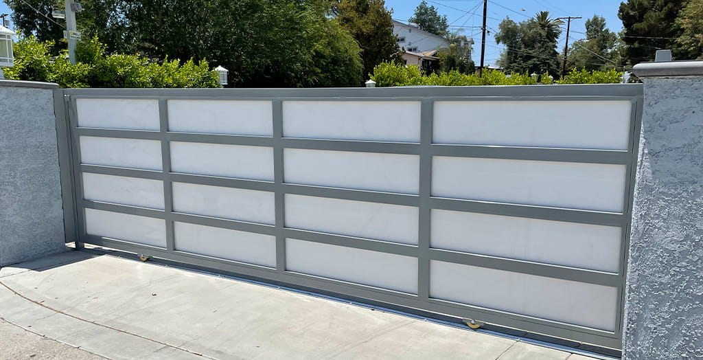 Modern commercial steel sliding gate fabricated for perimeter security and access control